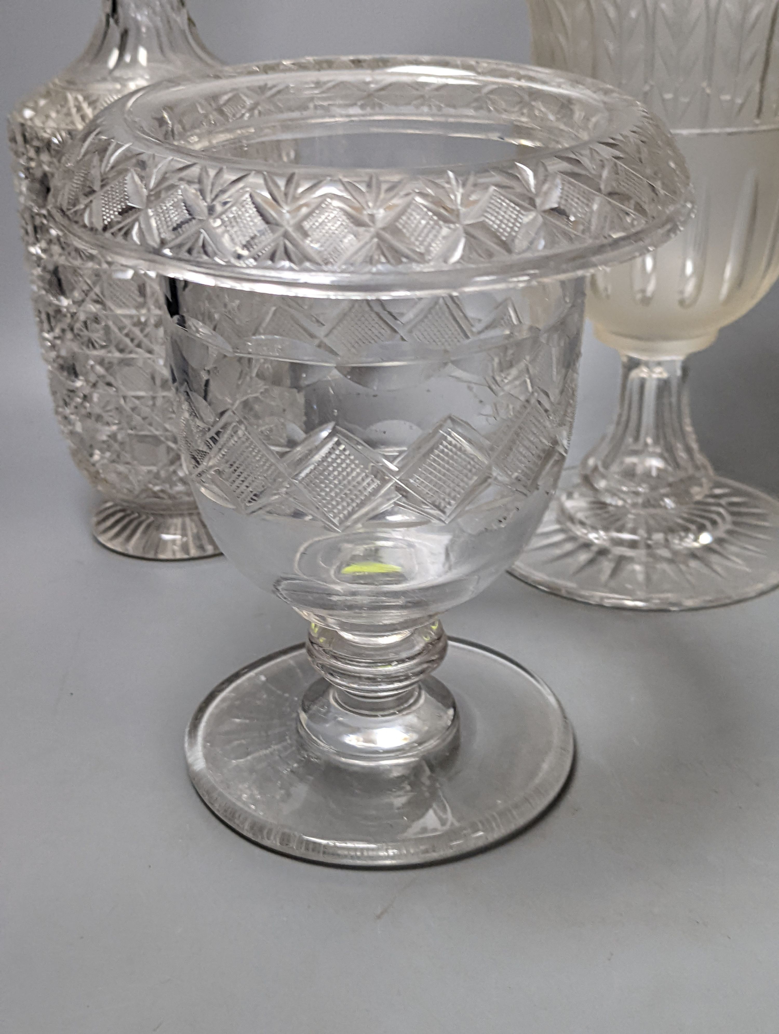 A Victorian wheel engraved ewer,with quinine scenes after the antique, 26 cms high, including 3 celery vases and a decanter.
